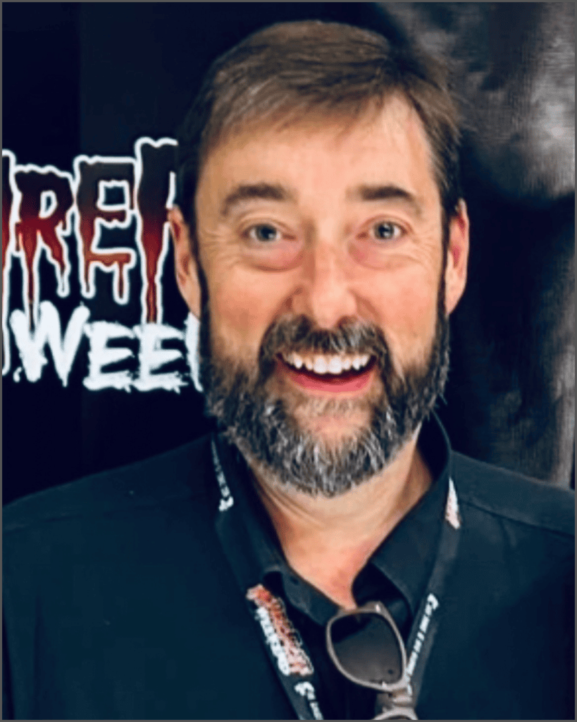 Joe Lewis smiling at the camera